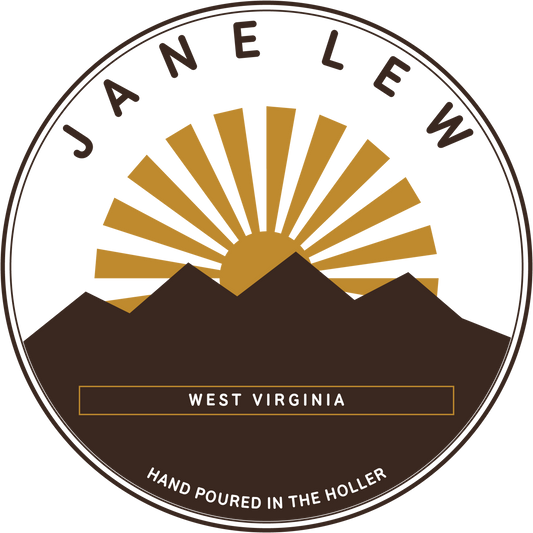 Jane Lew West Virginia badge design — sunrise over an Appalachian ridge, hand poured in the holler